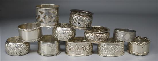 Two pairs of Edwardian silver napkin rings, seven other silver napkin rings including one Russian, 8 oz.